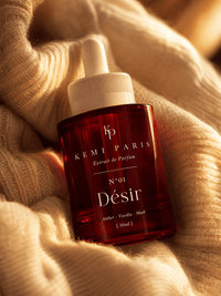 Désir extrait bottle — warm-skin still life