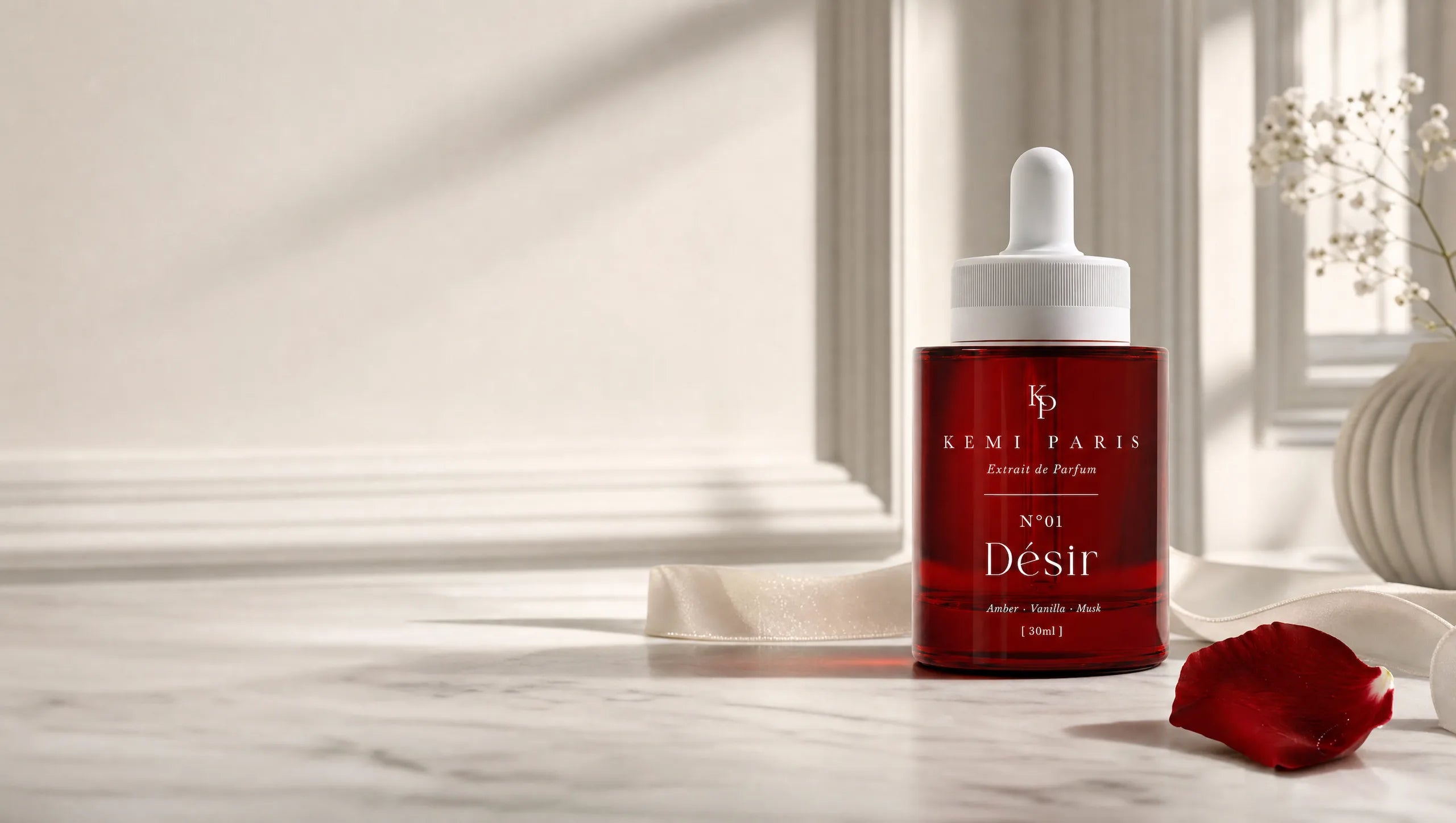 KEMI PARIS N°01 Désir — red extrait de parfum flacon on a marble vanity